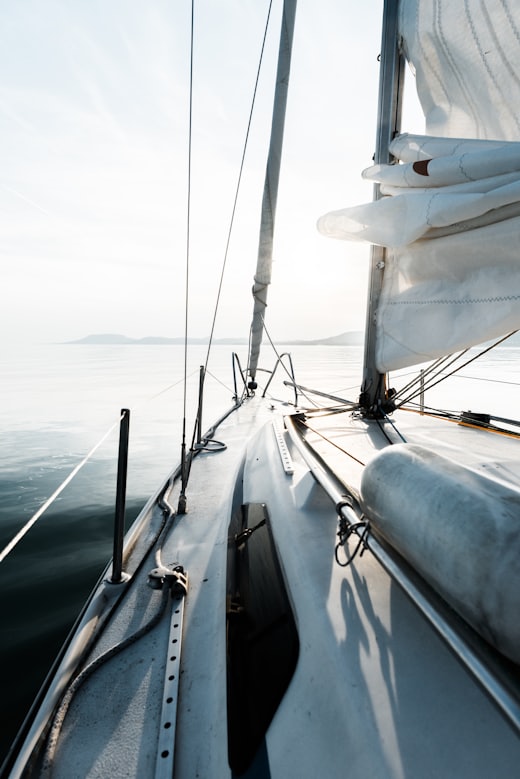 Small sailboat offshore on open water