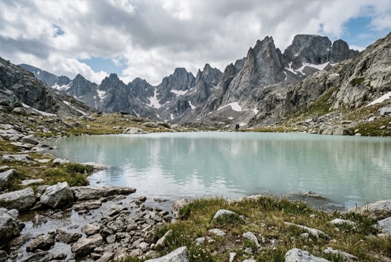 Silty glacial tarn below high granite peaks